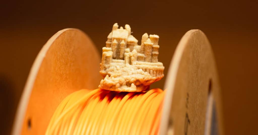 Harry Potter Hogwarts polymer matrix composite sitting on orange polymer filament